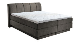 Boxspringbett Ole in Taupe aus einem Stoffbezug.