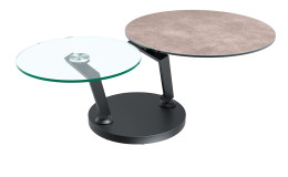Couchtisch MONDO Varium mit einer Glas-Keramik Tischplatte in Zementgrau und einer Klarglasplatte mit einem schwarzen Stahlgetsell.