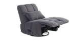 Relax-Sessel in grauem Cordstoff bezogen mit einem Zierkissen mit hochgestelltem Fußteil.