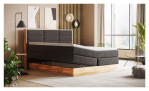 Boxspringbett VALMONDO Incana in einem Stoffbezug in Charcoal und einem Sichtholzrahmen in Eiche. Mit geöffneten Bettkasten