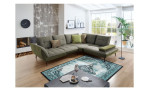 Komfort-Ecksofa vito Ticona, in der Farbausführung Stone / Olive, in einem Raum stehend