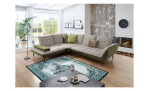 Komfort-Ecksofa vito Ticona, in der Farbausführung Natur / Olive, in einem Raum stehend