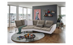Komfort-Ecksofa vito Ticona, in der Farbausführung Taupe / Silver, in einem Raum stehend mit der Rückenfunktion