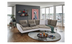 Komfort-Ecksofa vito Ticona, in der Farbausführung Taupe / Silver, in einem Raum stehend mit der Rückenfunktion