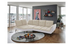 Basis-Ecksofa vito Ticona, in der Farbausführung Creme / Silber, in einem Raum stehend