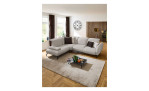 Komfort-Ecksofa vito Bevy, in der Farbausführung Natur, in einem Raum stehend