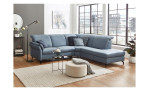 Komfort-Ecksofa vito Sardena, in der Farbausführung Greyblue, mit Kissen, in einem Raum stehend