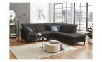 Basis-Ecksofa vito Sardena, in der Farbausführung Elephant, in einem Raum stehend