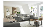 Komfort - Ecksofa Musterring MR 370, in der Farbausführung silber mit einem Hocker, in einem Raum stehend